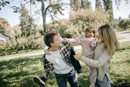 parents with kids playing