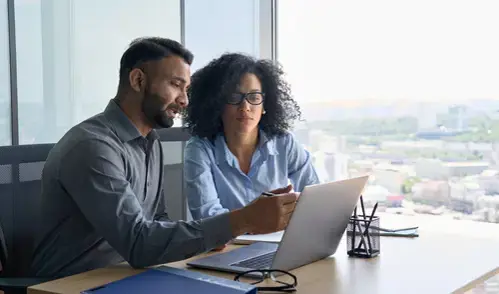 A couple looking at a computer